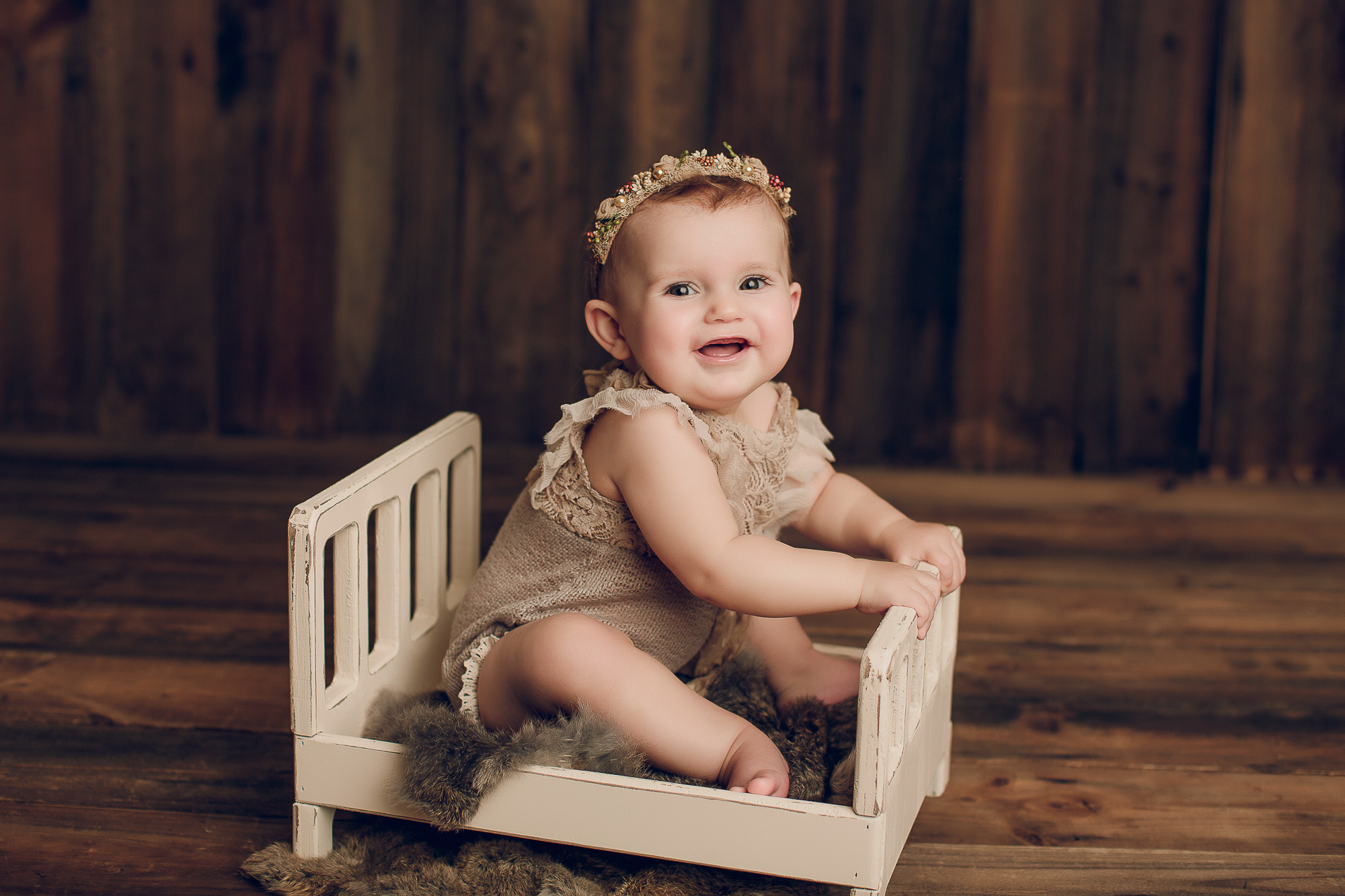 Adelaide baby photographers photo of a 9 month old baby girl sitting.