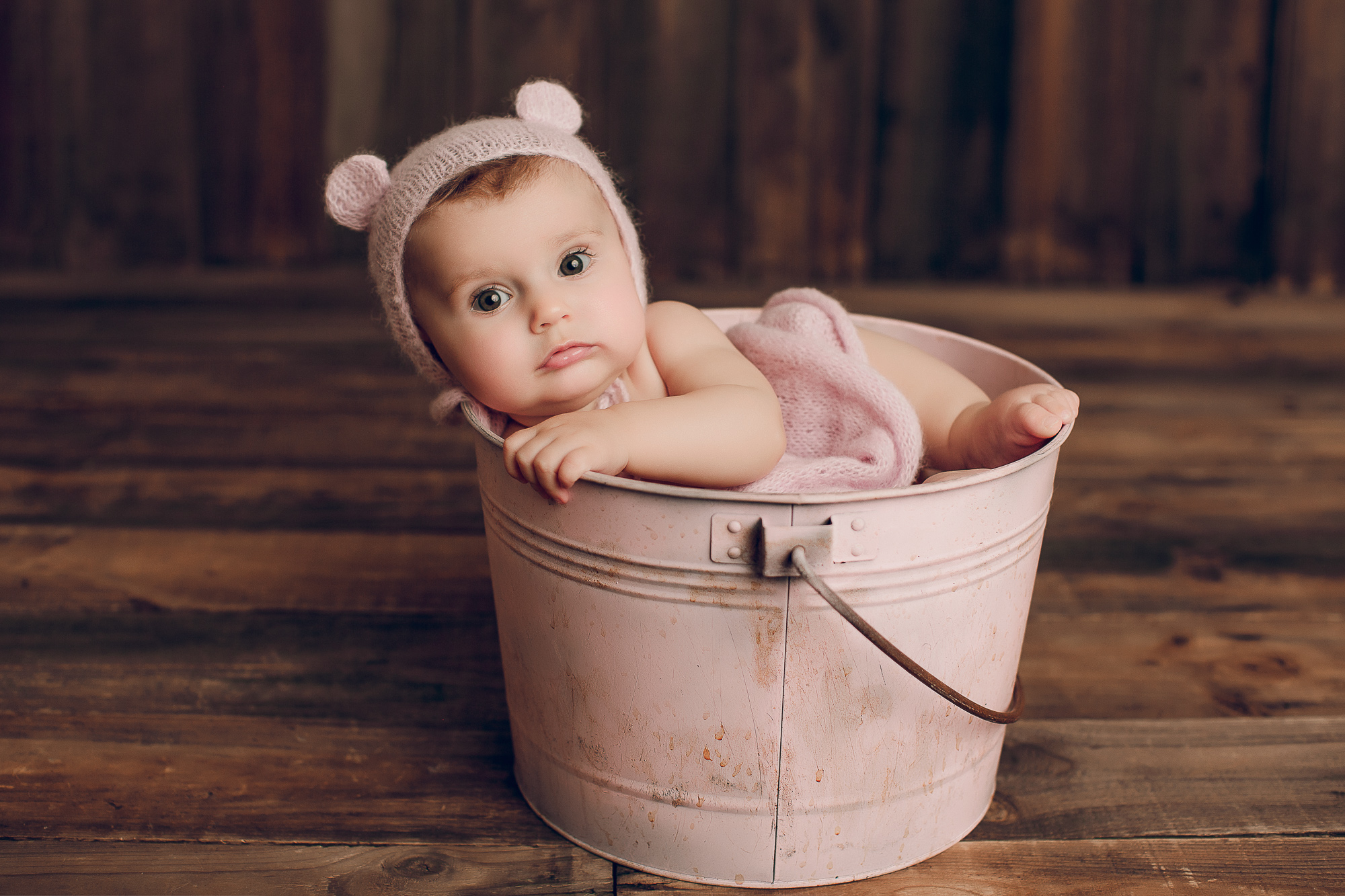 Adelaide baby photographers photo of a 9 month old baby girl sitting.