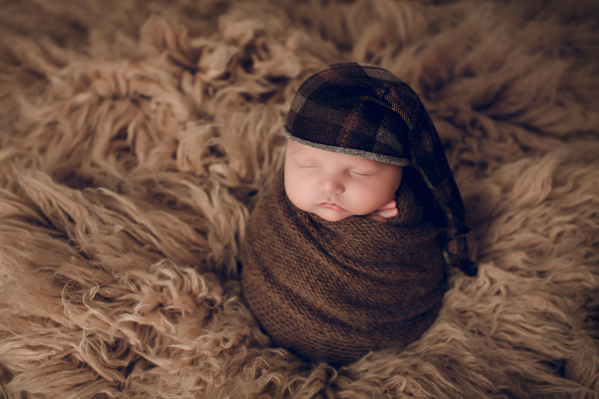 Adelaide Newborn photography photo of a newborn baby wrapped up.