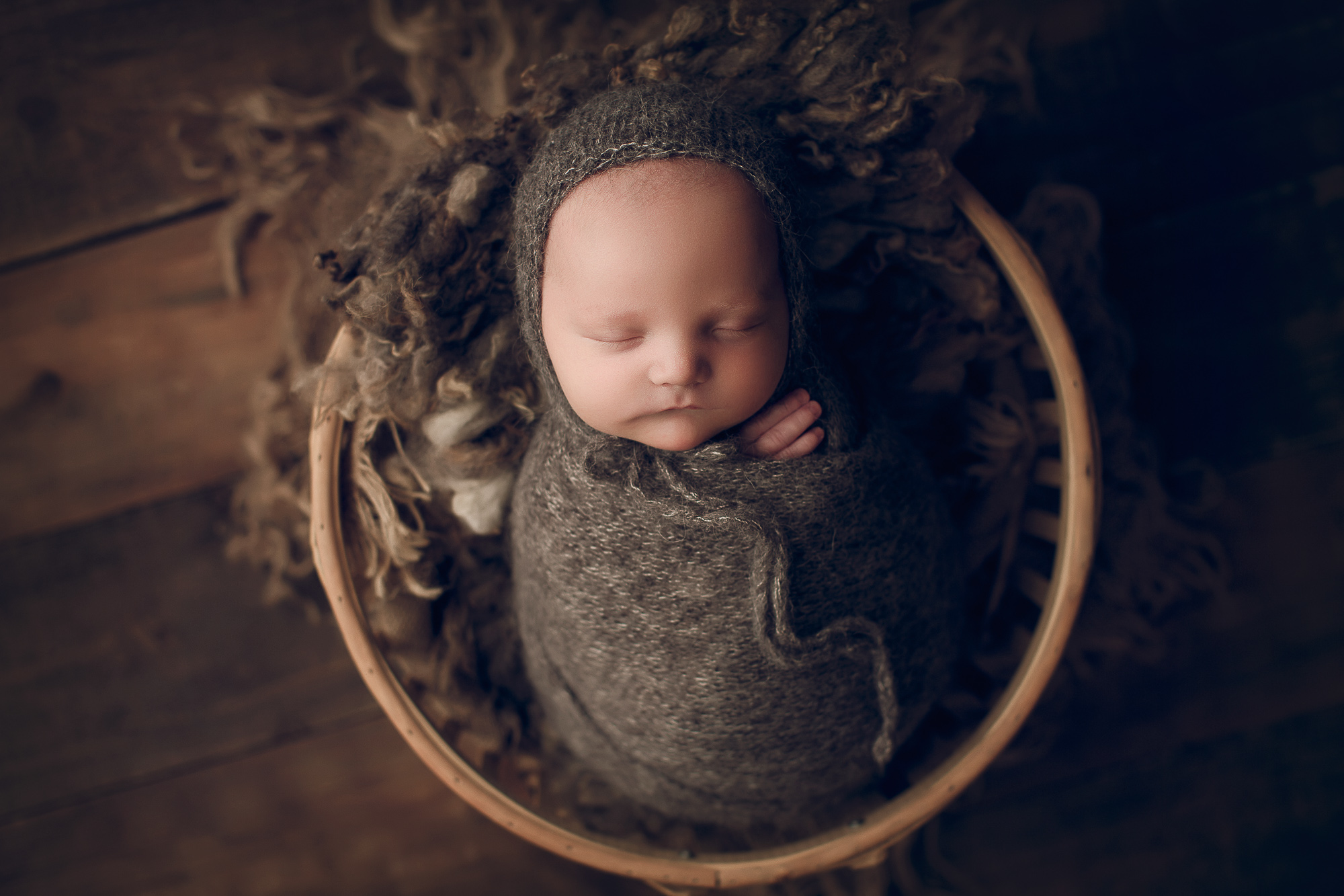 Adelaide Newborn photography photo of a newborn baby in a basket.