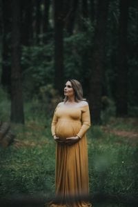 Adelaide maternity photographer's photo of a pregnant mother in a mustard dress.