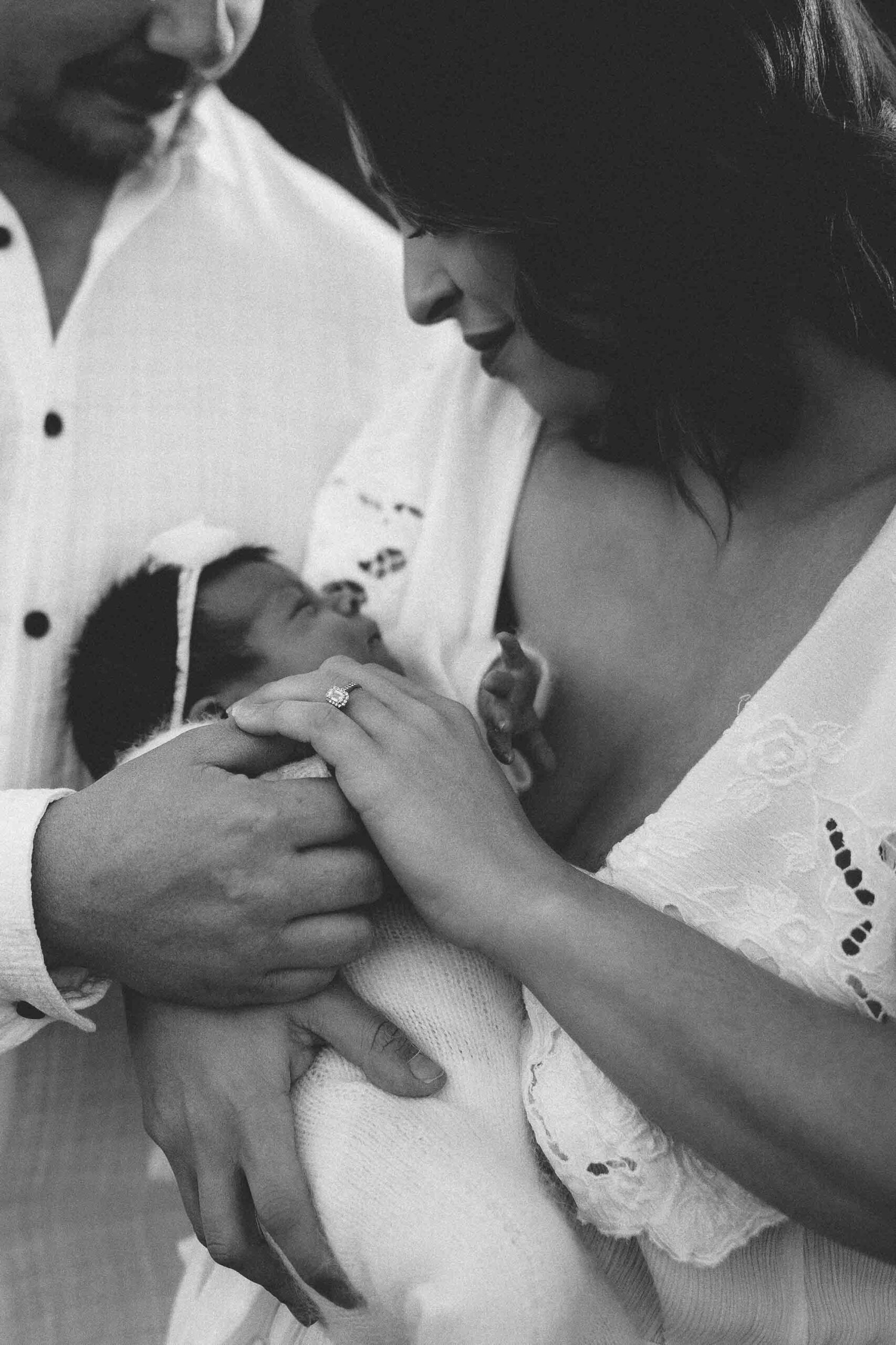 An Adelaide mum and dad with their newborn baby at an outdoor photography session.