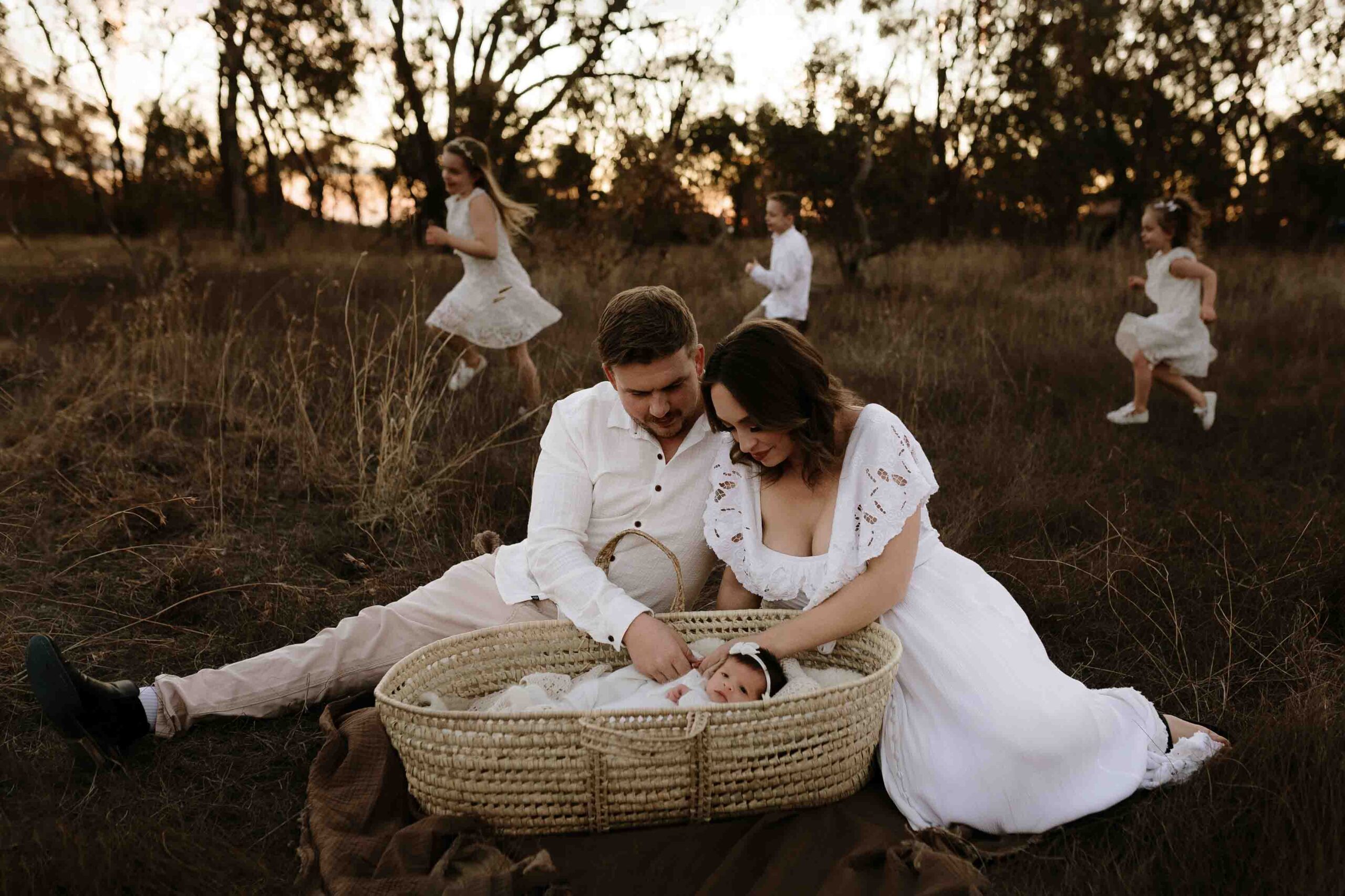 An Adelaide mum and dad with their newborn baby at an outdoor photography session.