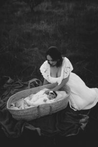 An Adelaide mum with their newborn baby at an outdoor photography session.