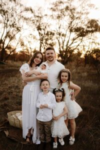 An Adelaide family of 6 at a photo shoot at sunset.