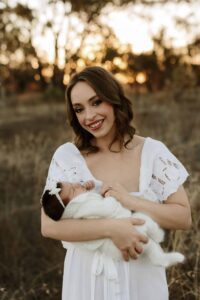 An Adelaide mum with their newborn baby at an outdoor photography session.