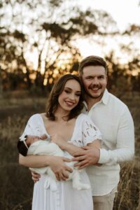An Adelaide mum and dad with their newborn baby at an outdoor photography session.