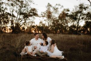 An Adelaide family of 6 at a photo shoot at sunset.