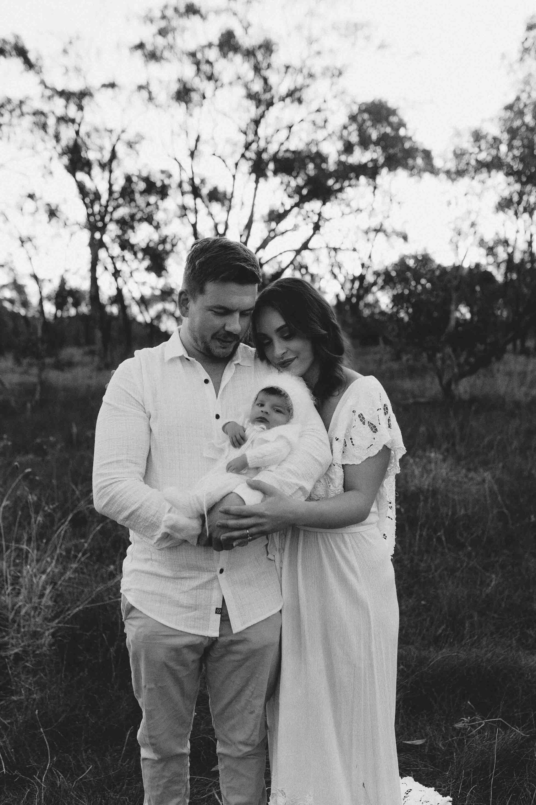 An Adelaide mum and dad with their newborn baby at an outdoor photography session.