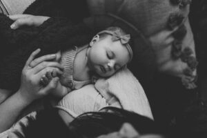 An Adelaide mum cuddling with her 12 week old baby girl.