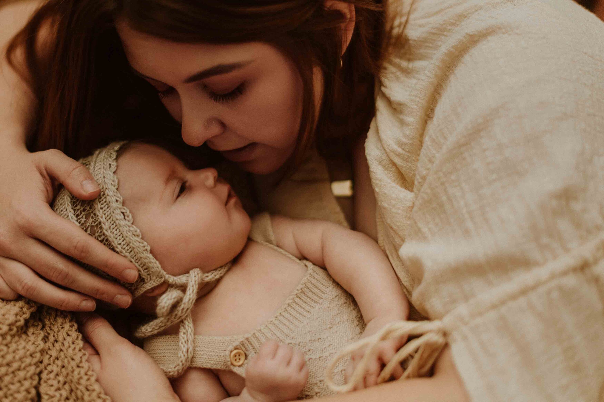 An Adelaide mum cuddling with her 12 week old baby girl.