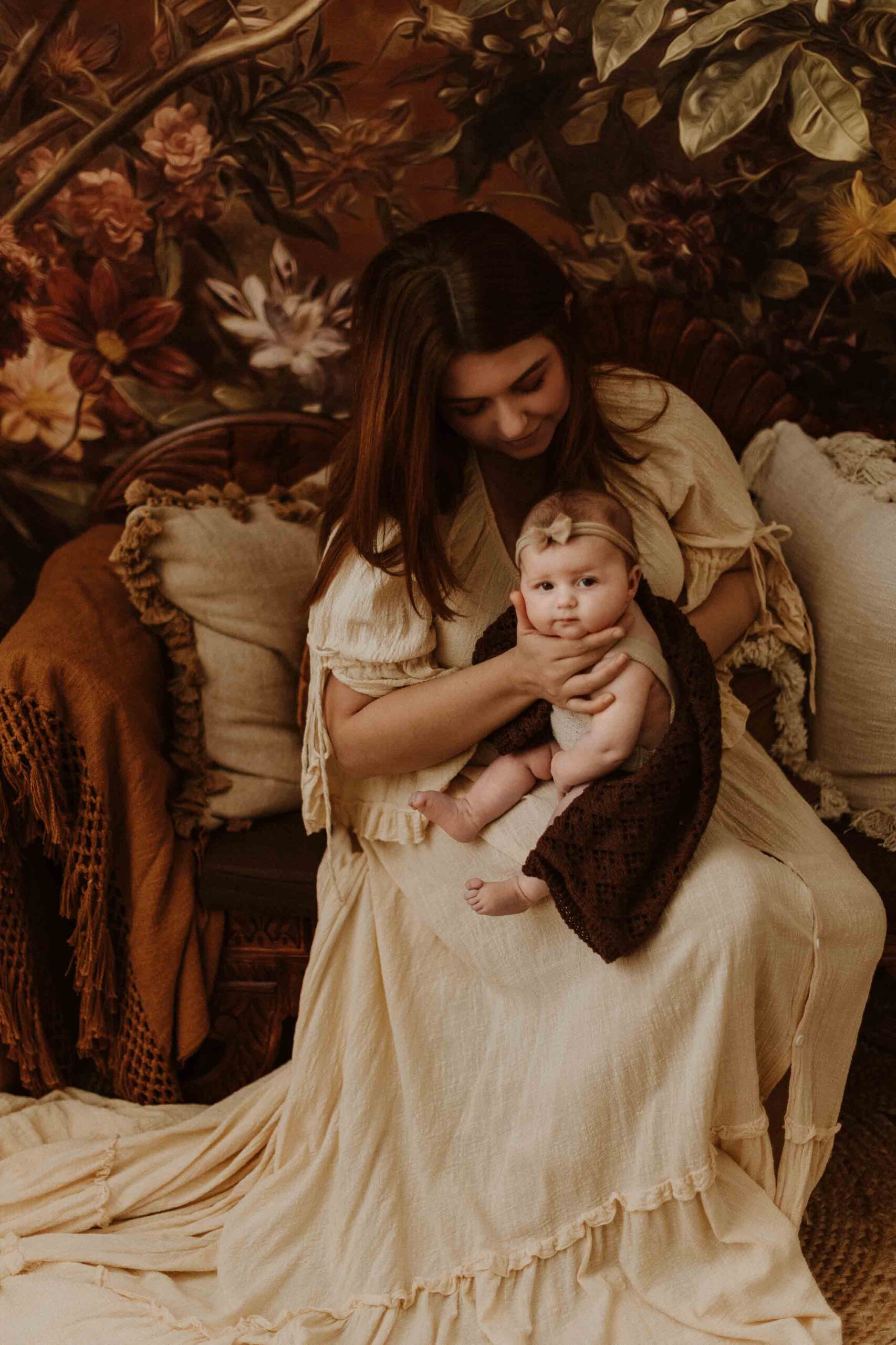 An Adeliade mum holding up her 12 week old baby and giving her a burp.