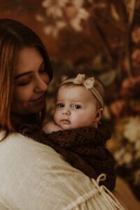 An Adelaide mum cuddling with her 12 week old baby girl.
