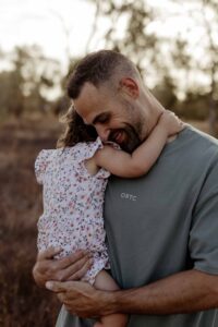 Natural outdoor family photography in Adelaide with parents and young children.