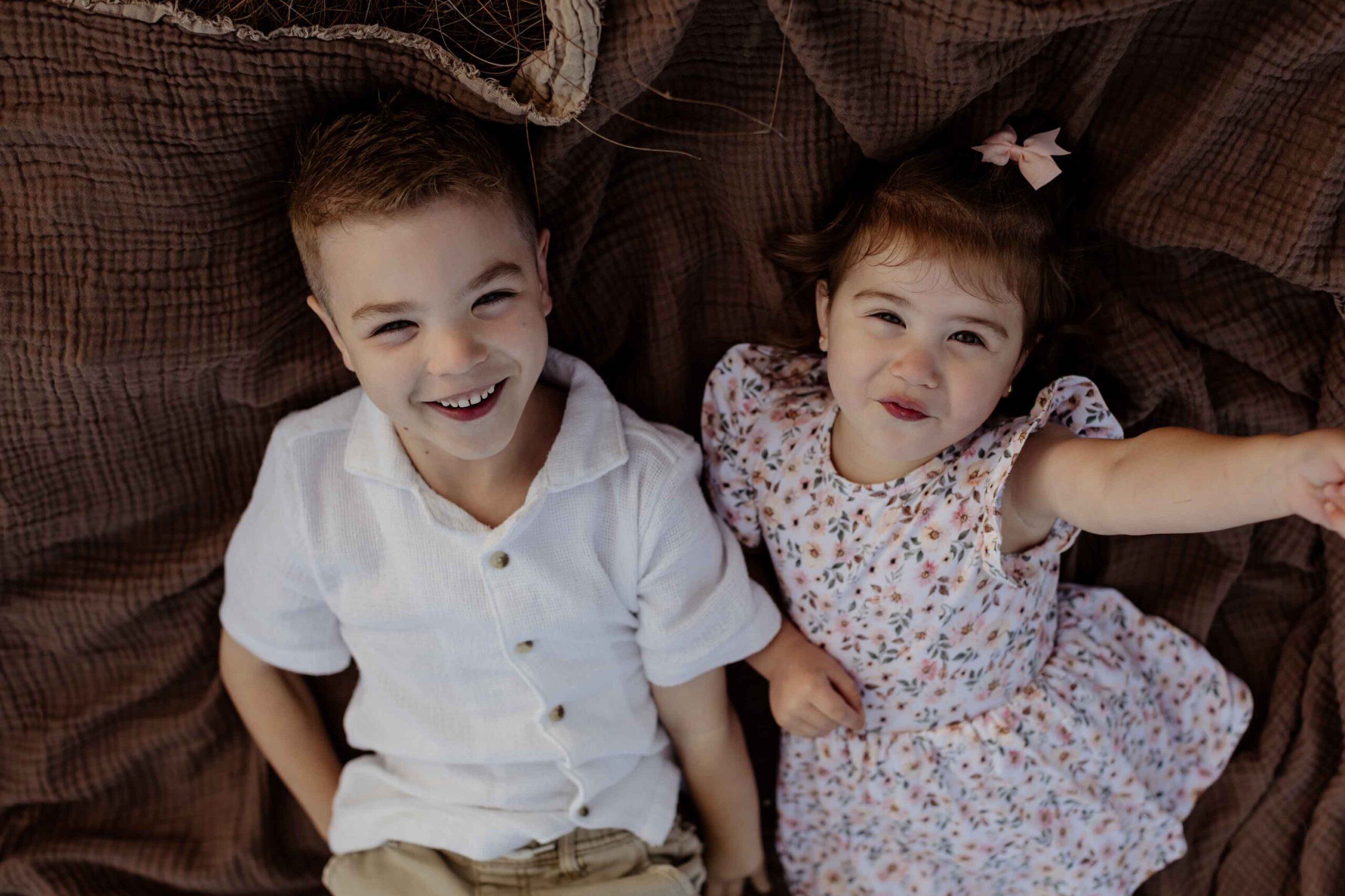 Candid sibling moments during an Adelaide family photography session.