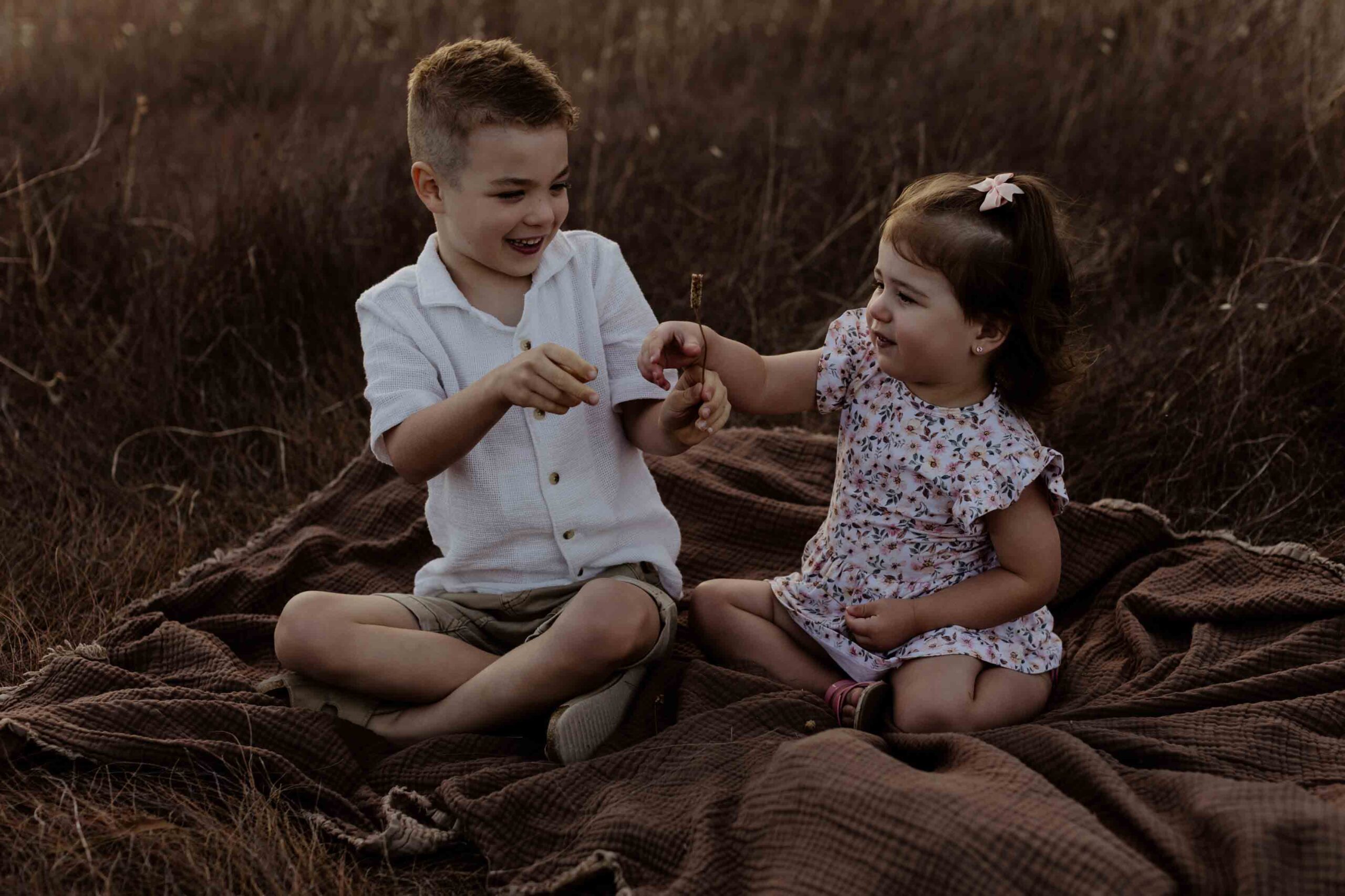 Outdoor family photography in Adelaide showing children playing naturally.