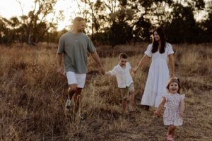Outdoor family photography in Adelaide showing children playing naturally.
