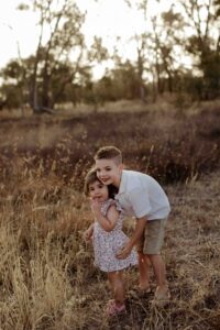 Outdoor family photography in Adelaide showing children playing naturally.