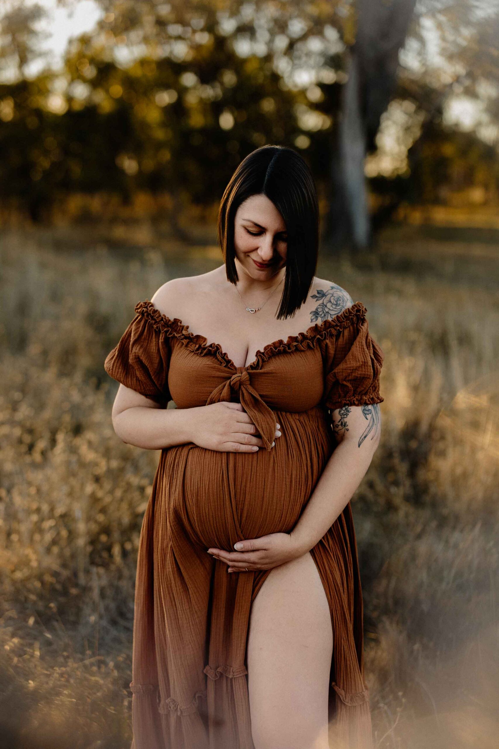 A mum from Adelaide looking at her pregnant belly.